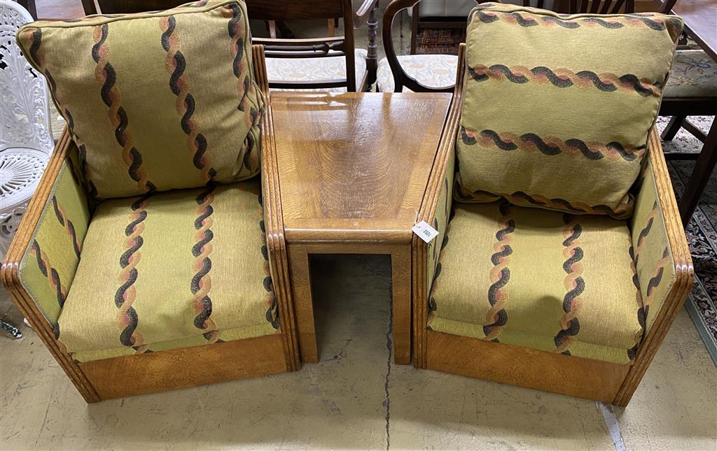 An Art Deco oak three section conversation seat, possibly with its original upholstery, width 170cm, depth 70cm, height 71cm